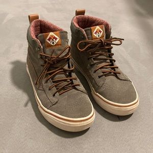Gray and brown vans hiking high tops.